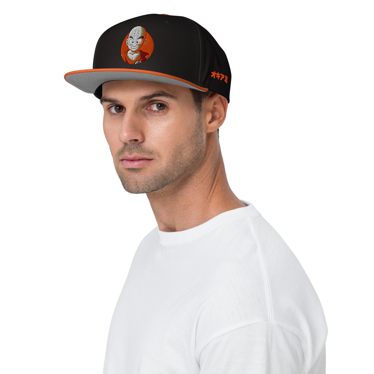 Anime fan wearing the Krillin Snapback Hat, showcasing bold Dragon Ball-inspired design. 