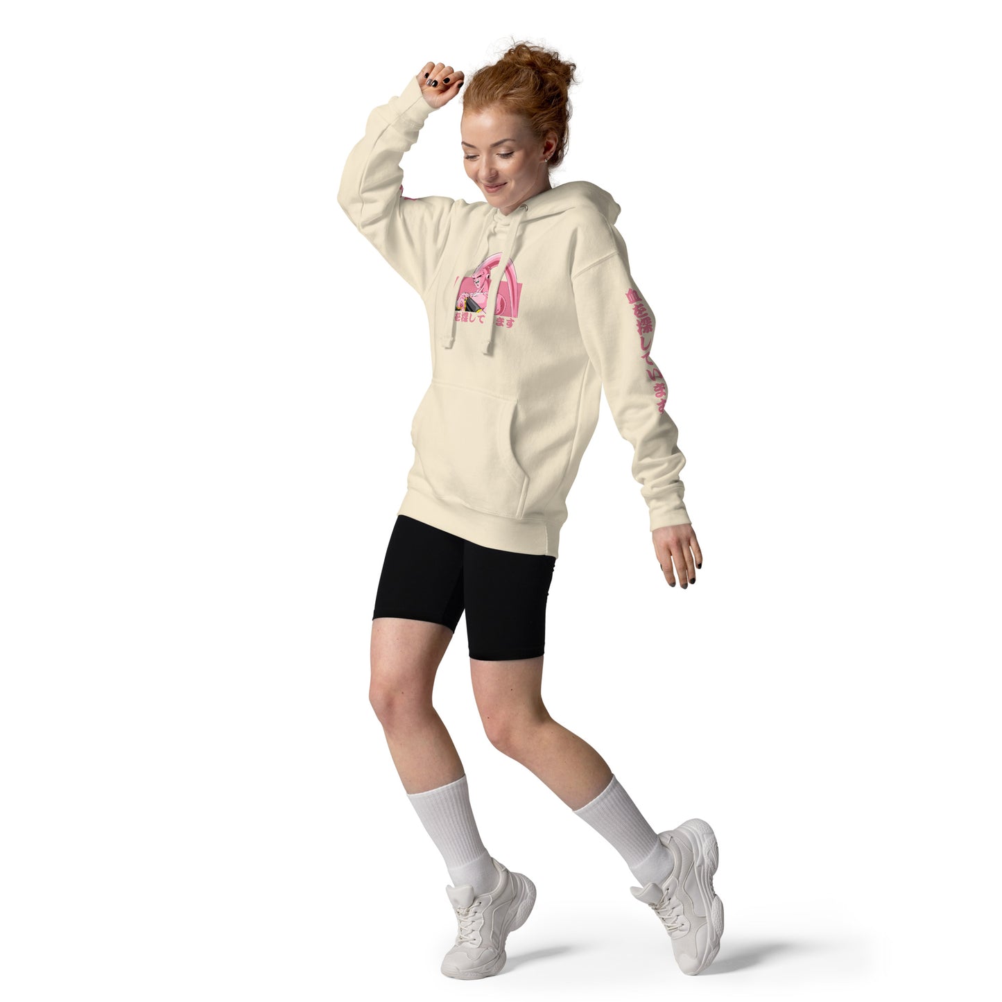 Girl wearing the Majin Buu Hoodie, showcasing its anime streetwear style. Posing towards camera.